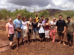 Getting dirty making mud bricks to build a classroom