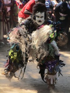 Masked Nyau dancer performs in the village