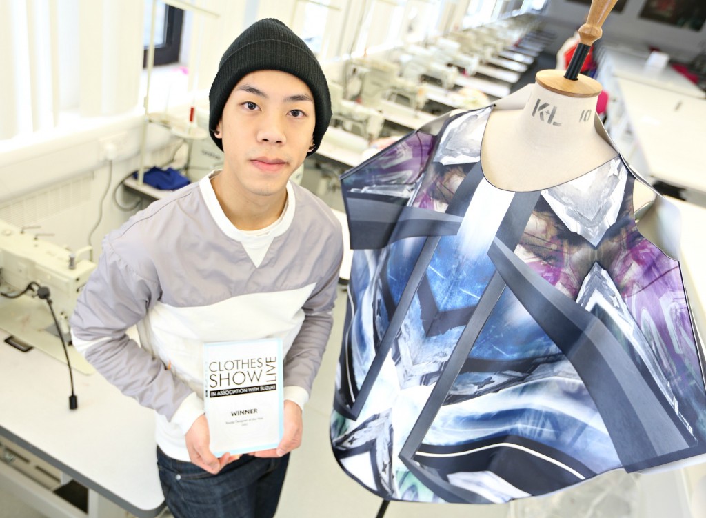 Third-year student Curtis Li with his award-winning garment in the fashion studios at Coventry University.