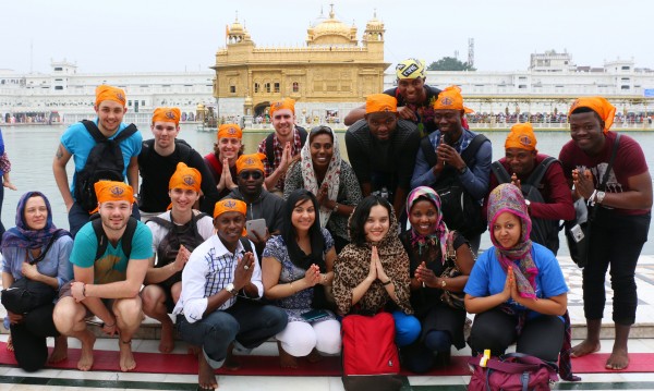 The group take in the beautiful site that is the Golden Temple at Amritsar while showing the respectful sign of ‘Namaste’.