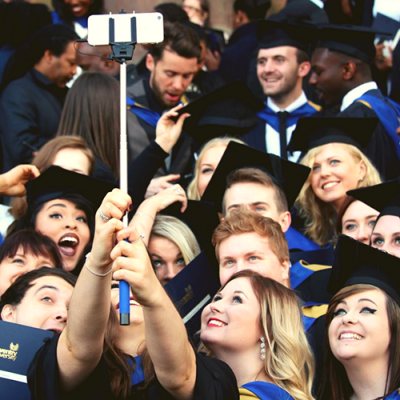 students-taking-selfies-on-graduation-day