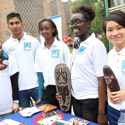 students-standing-and-posing-at-society-stand