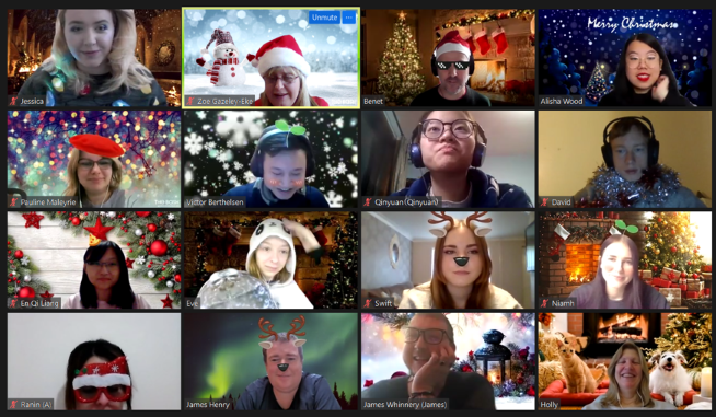 screencapture of a zoom call showing lots of students, some with festive backgrounds