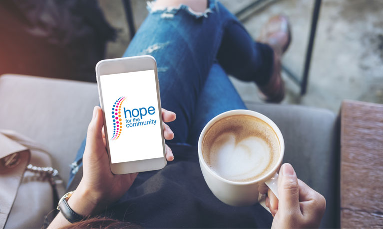Hope for communities logo on phone screen