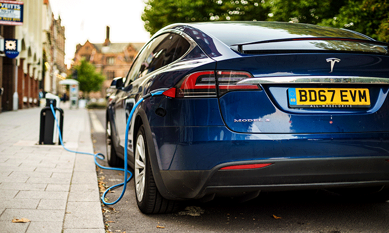 Electric car charging on the road